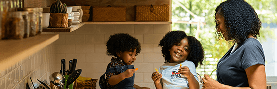 Mother preparing lunch for children